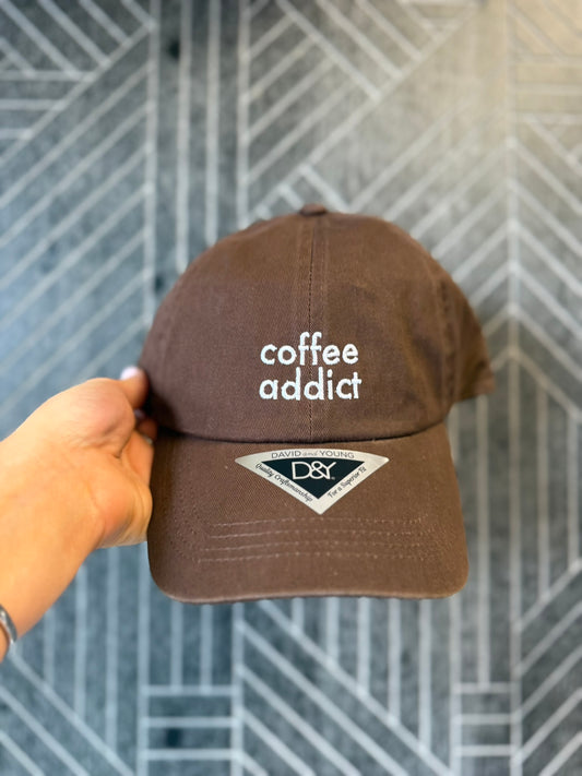 Coffee Addict embroidered cotton baseball cap with adjustable back strap.