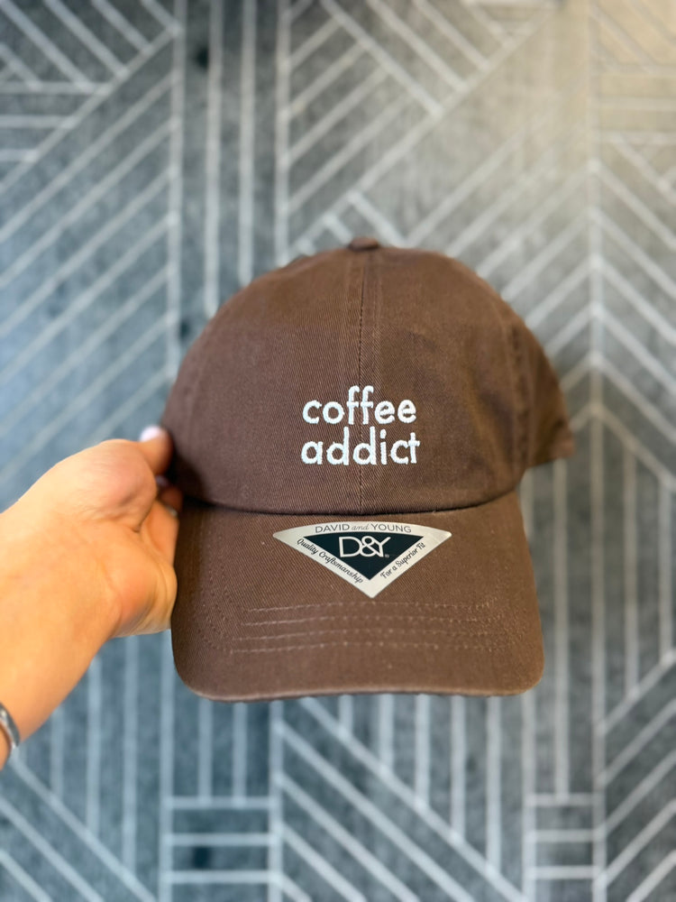 Coffee Addict embroidered cotton baseball cap with adjustable back strap.